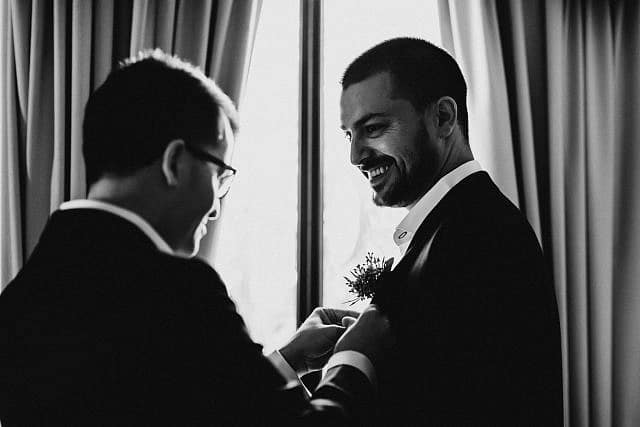 Henley Brook Wedding Photographer at Albion on the Swan Groomsmen sharing moment