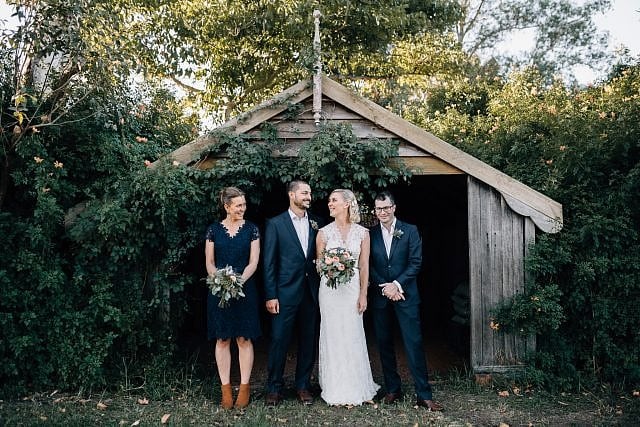 Bridal party having fun together sharing a natural moment for their photo session