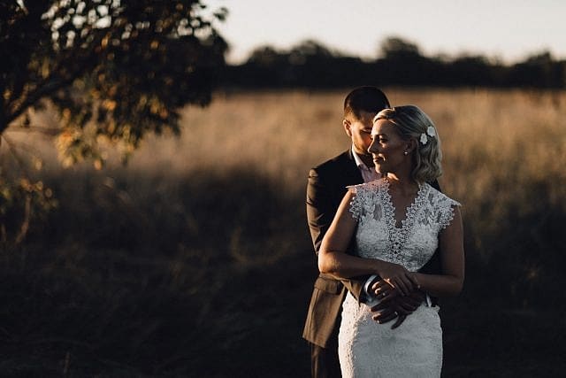 Wedded couple cuddle in the sun at Albion on Swan in Henley Brook