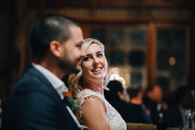 Bride lovingly stares at Groom during their celebrations