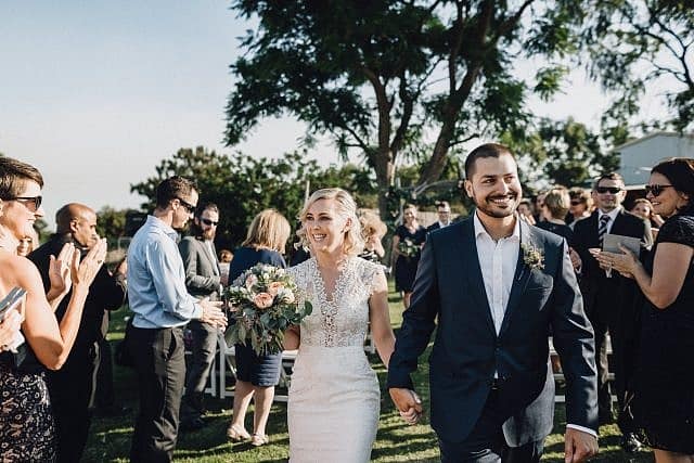 Bride & Groom exit down the aisle at Albion on the Swan