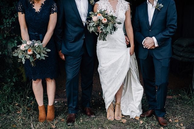 Picture of bridal parties feet, shoes & wedding dress