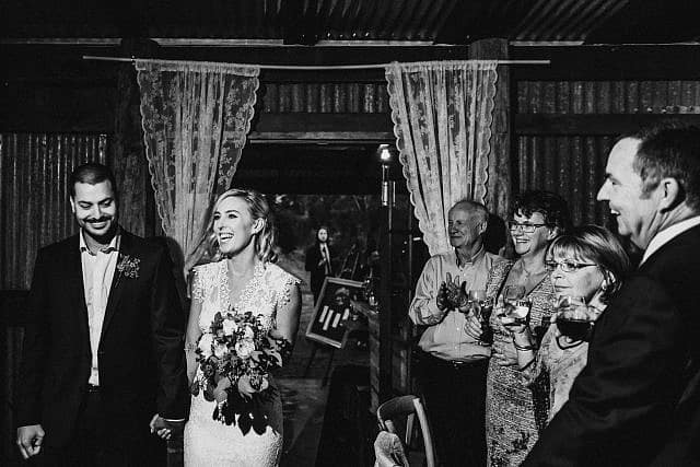 Bride enter shed at Albion on Swan for their Reception with family & Friends cheering