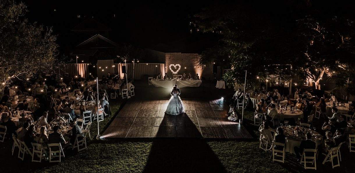 wedding couple first dance in their private property back yard reception