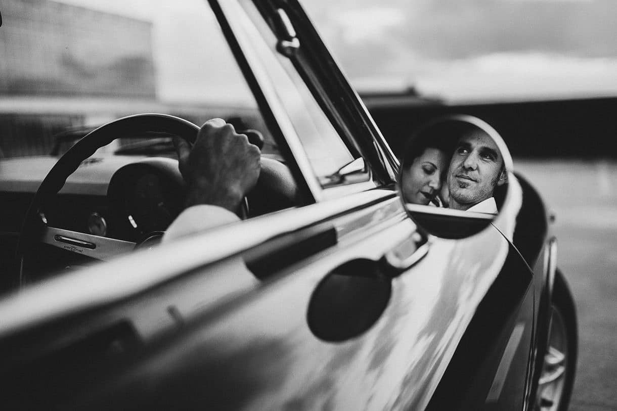 Perth retro wedding couple sit in retro alfa romeo