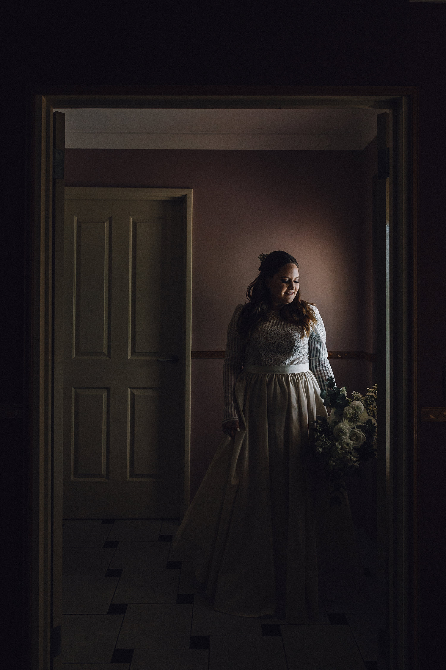 Gorgeous Moody Dark Bride Holding Bouquet