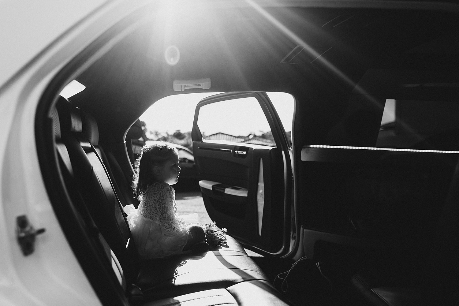 Flower Girl Waiting In Limousine