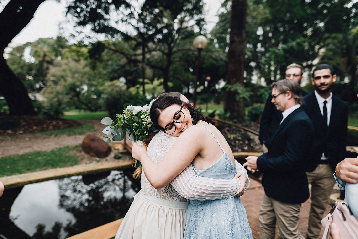 Bride & Sister Hug During Congratulations