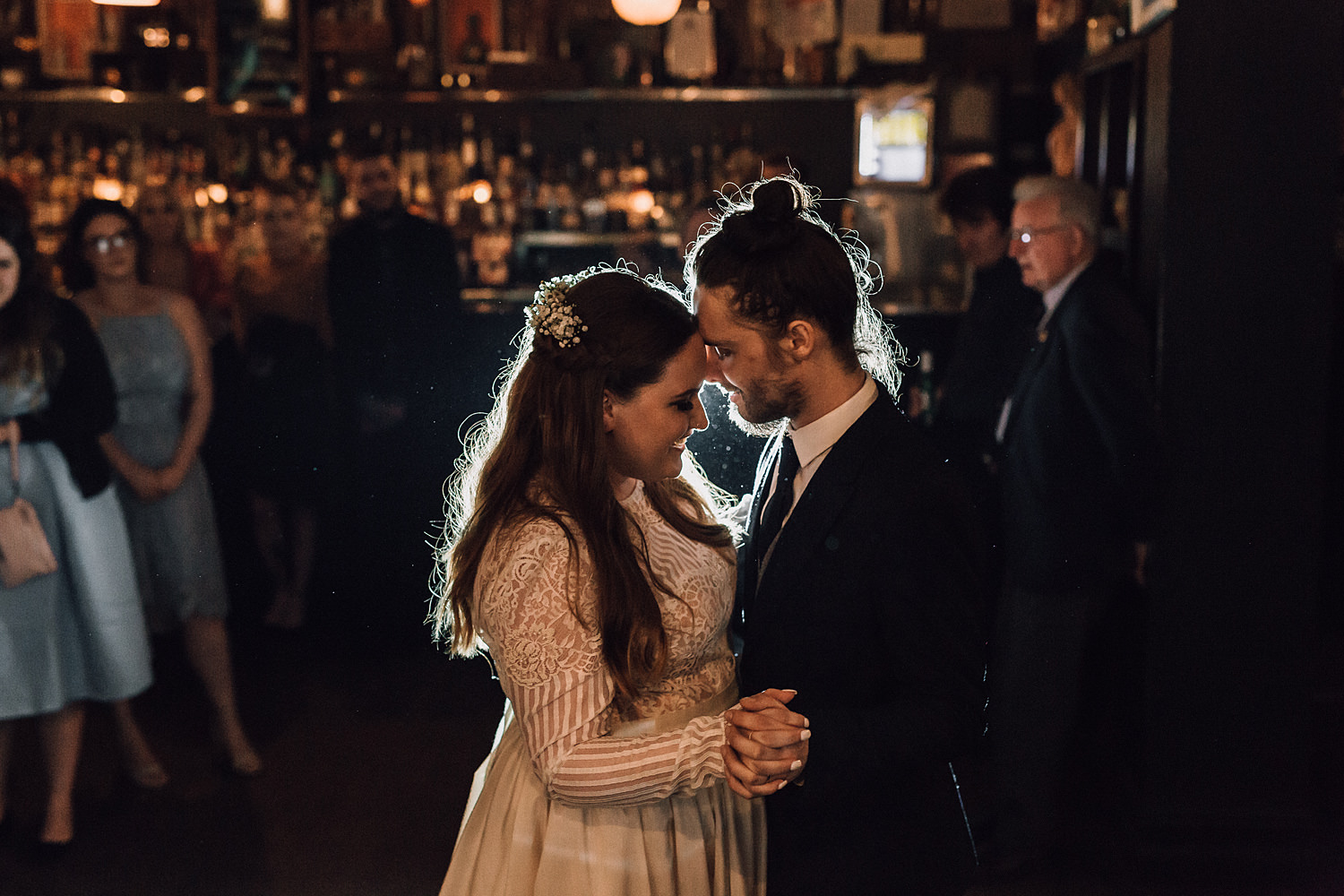 Wedding Coulpe Illuminated By Light During Dance