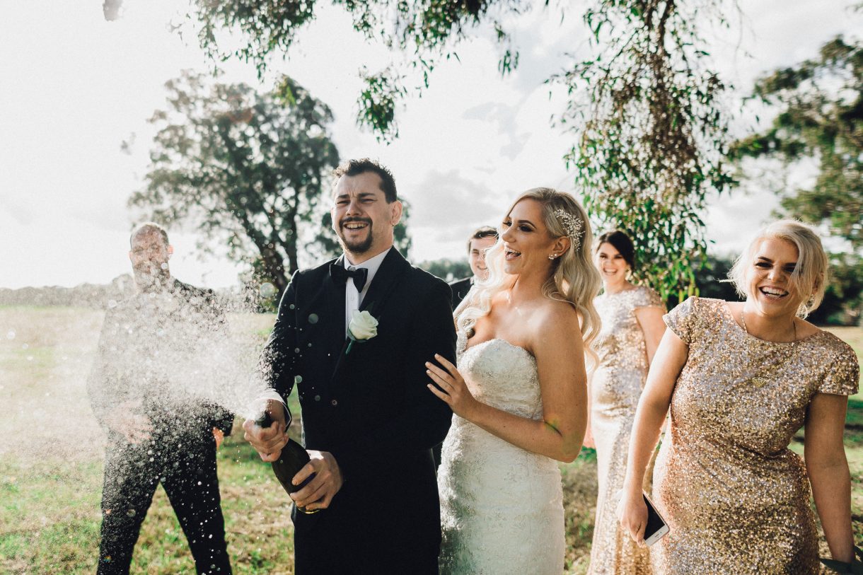 groom sprays champagne wedding swan valley