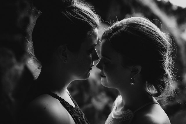 Gay Brides Hugging Wedding